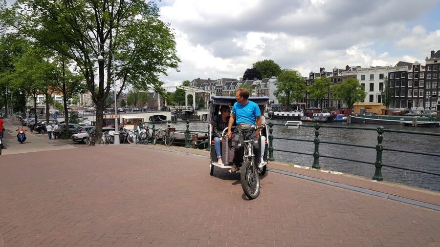 Amsterdam: 2-Hour Sightseeing Tour by Rickshaw - Weather, comfort, and who should skip it
