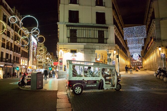 Christmas Lights Tour of Madrid in Eco Tuk Tuk Private - The Bank of Spain and Plaza de Canalejas
