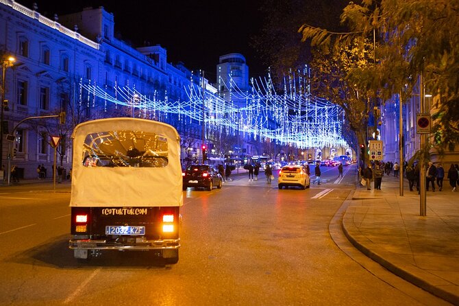 Christmas Lights Tour of Madrid in Eco Tuk Tuk Private - Congress, Neptune, and Madrid’s football rivalry