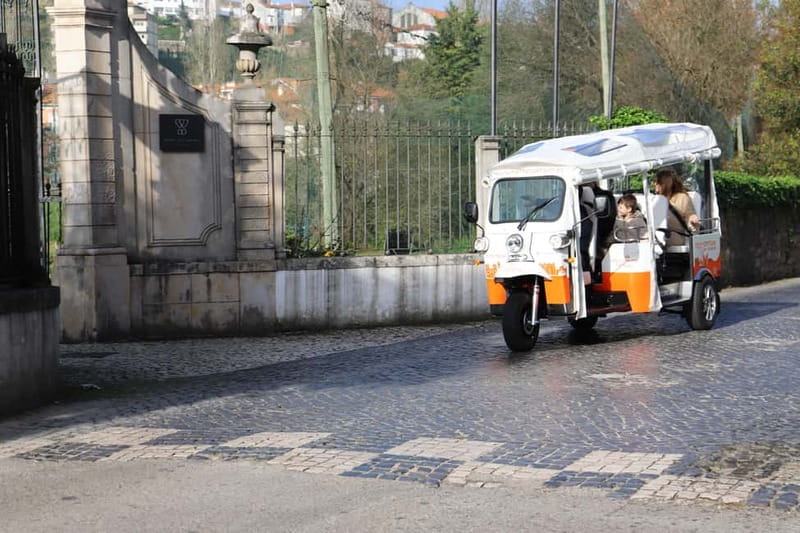 Coimbra: TukTuk Adventure. Local and multilingual host. Hotel pickup. - The first ride shows you Coimbra as a whole