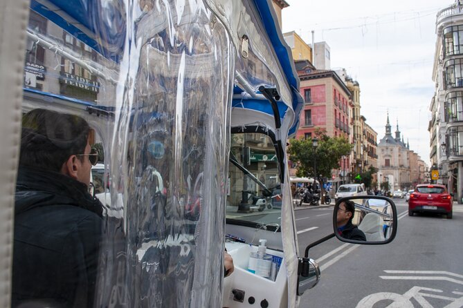 Eco Friendly Tuk Tuk Experience with the Local in Madrid - Neptune, Cibeles, and Puerta de Alcalá