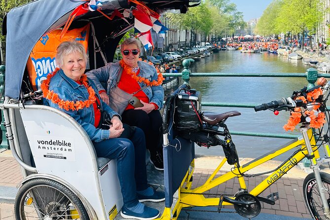 Explore Amsterdam in 75 Minutes – Pedicab Rickshaw City tour - Starting at Muntplein and meeting your driver