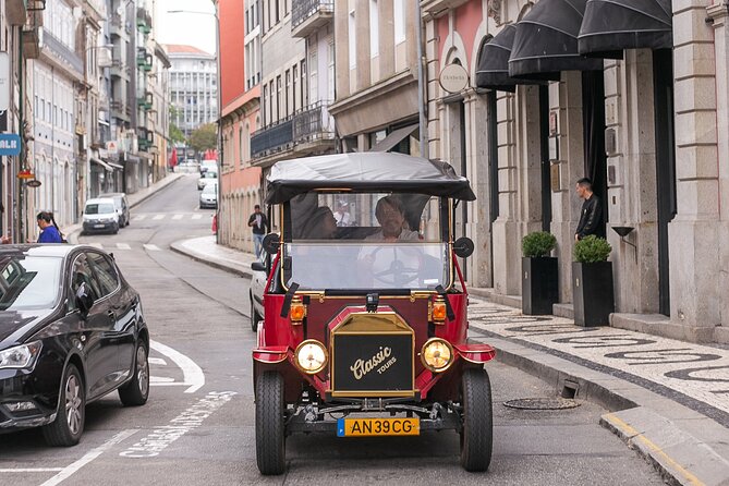 Explore Porto Aboard A Classic Tuk-Tuk tour 1h - Crossing Dom Luís I Bridge