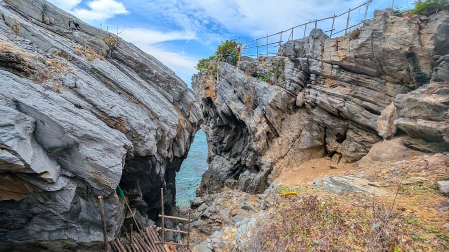 From Bangkok: Day Tour Koh Sichang Island with Tuktuk Tour - Tam Talu and the odd shape of the coast