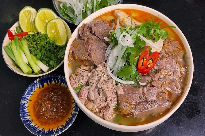 Hue Food Tour by Walking or Cyclo or Motorbike with Driver - Crossing Truong Tien Bridge with a plate waiting