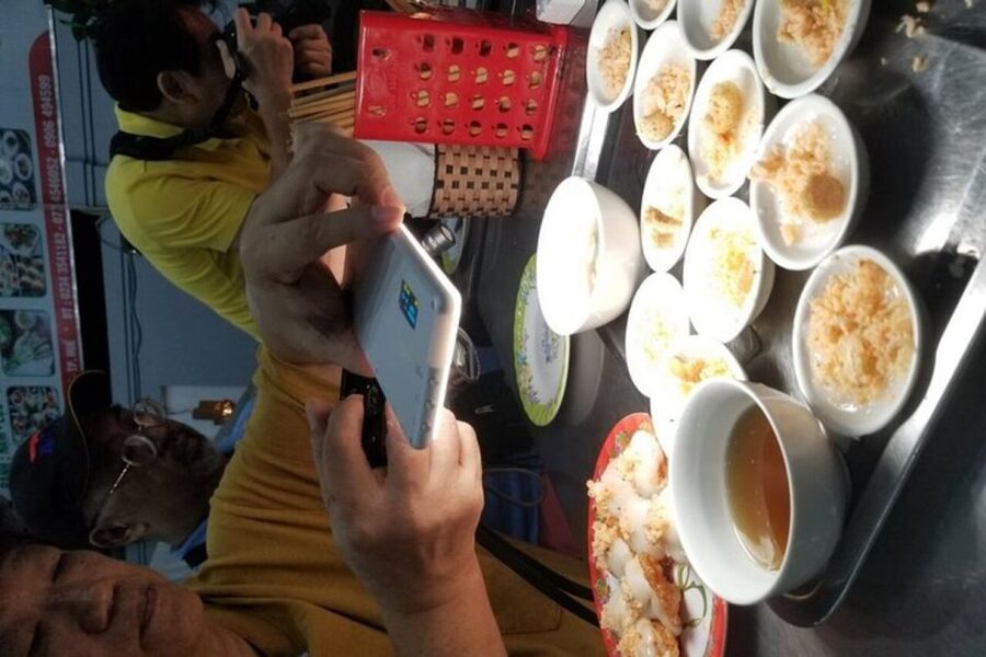 Hue: Night Street Food Tour by Cyclo with a Local Guide - Com hen reveals a different side of the Perfume River