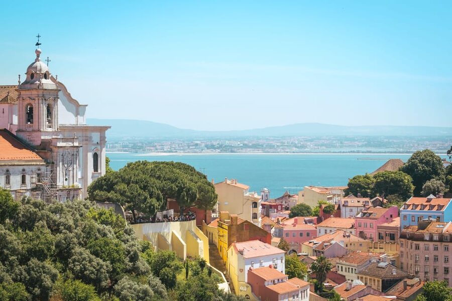 Lisbon: Sightseeing City Tour by Tuk-Tuk - Walking down toward Praça do Comércio