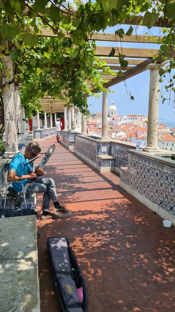 Lisbon: Tuk Tuk 1H30 Tour Old Town Complete with a Old Timer - Alfama at street level