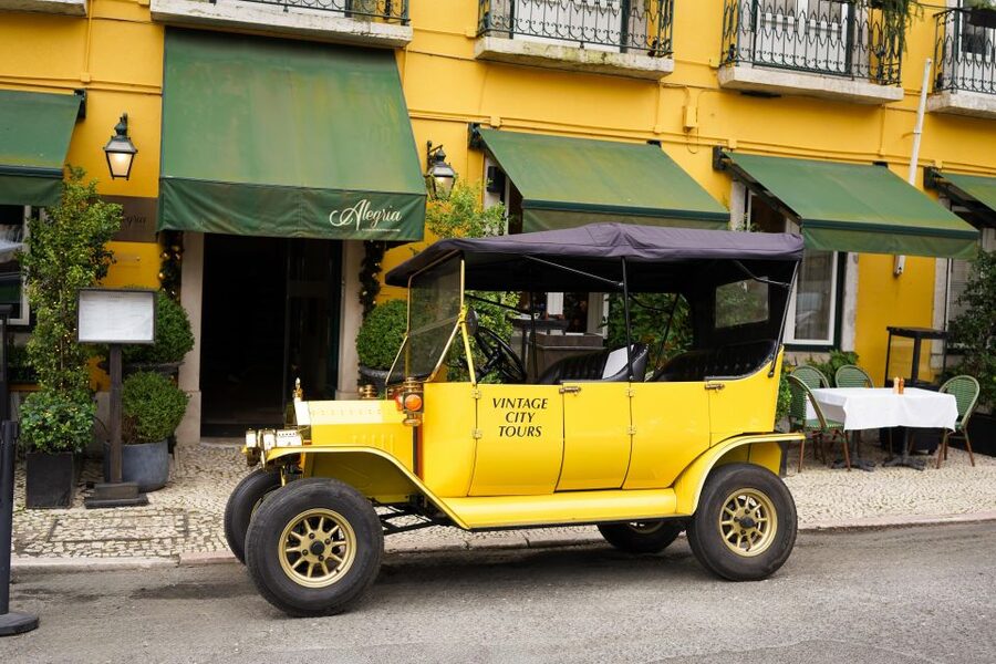 Lisbon: Tuk Tuk City tour with vintage car - Baixa fills in Lisbon’s central picture