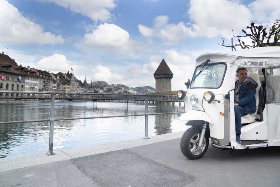 Lucerne: eTukTuk City Tour - Through Old Town and Beyond the Main Postcards