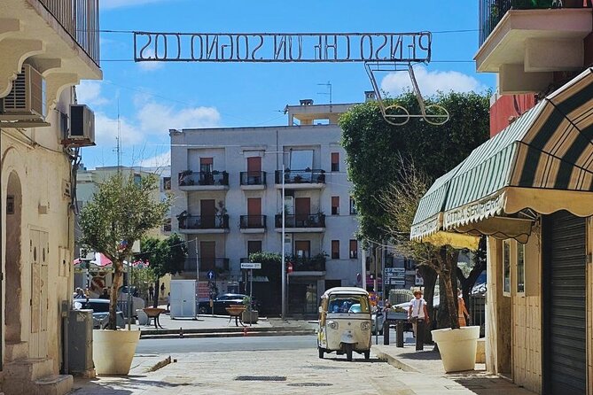 Polignano Coast with Private Tuk Tuk Tour and View of the Caves - Views of caves and the old village above the sea