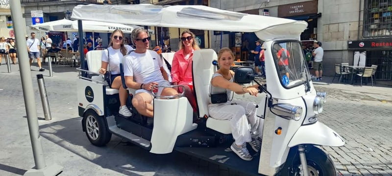 "See Madrid Differently: A Premium Private Tuk Tuk Ride" - Starting near the Royal Palace and Plaza Mayor