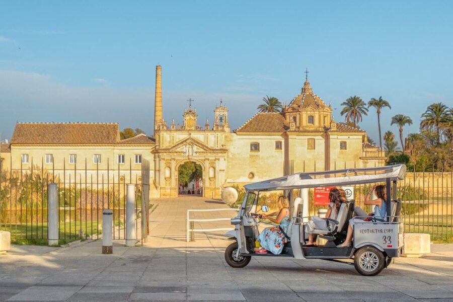 Seville: Private City Tour by Eco Tuk Tuk - Crossing Puente de Isabel II into Triana