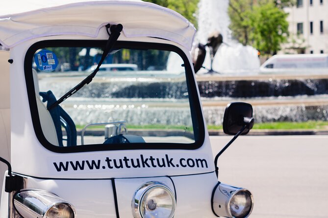 Tour of Historic and Modern Madrid with a guide in a yellow tuk tuk - Parks, churches, and a welcome chance to stretch