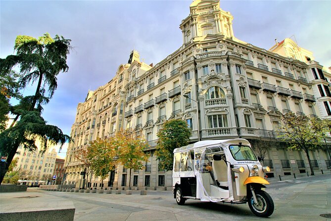 Tour of Historic and Modern Madrid with a guide in a yellow tuk tuk - Royal Madrid and the great central streets