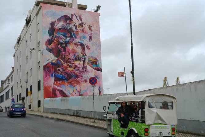 Tuk Tuk Lisbon: Exploring Urban Art - Vhils in a quiet Graça lane