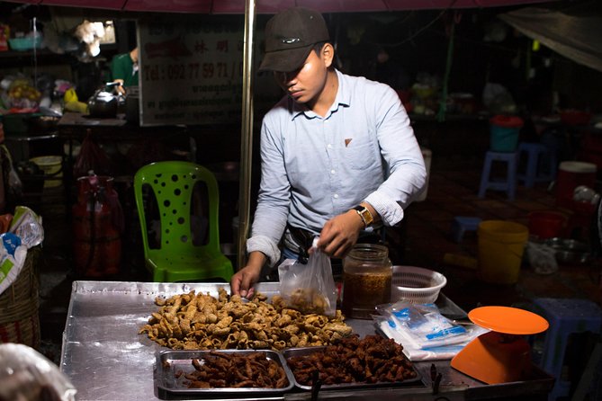 Ultimate Phnom Penh Food Tour by Tuk Tuk: 20 Tastings and Drinks - Russian Market after dark: ingredients and smoky ribs