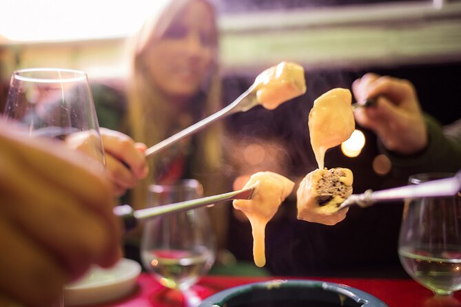 Zurich eTukTuk Private Tour - with Cheese Fondue and Wine - Niederdorf, Predigerplatz, and the Rathaus